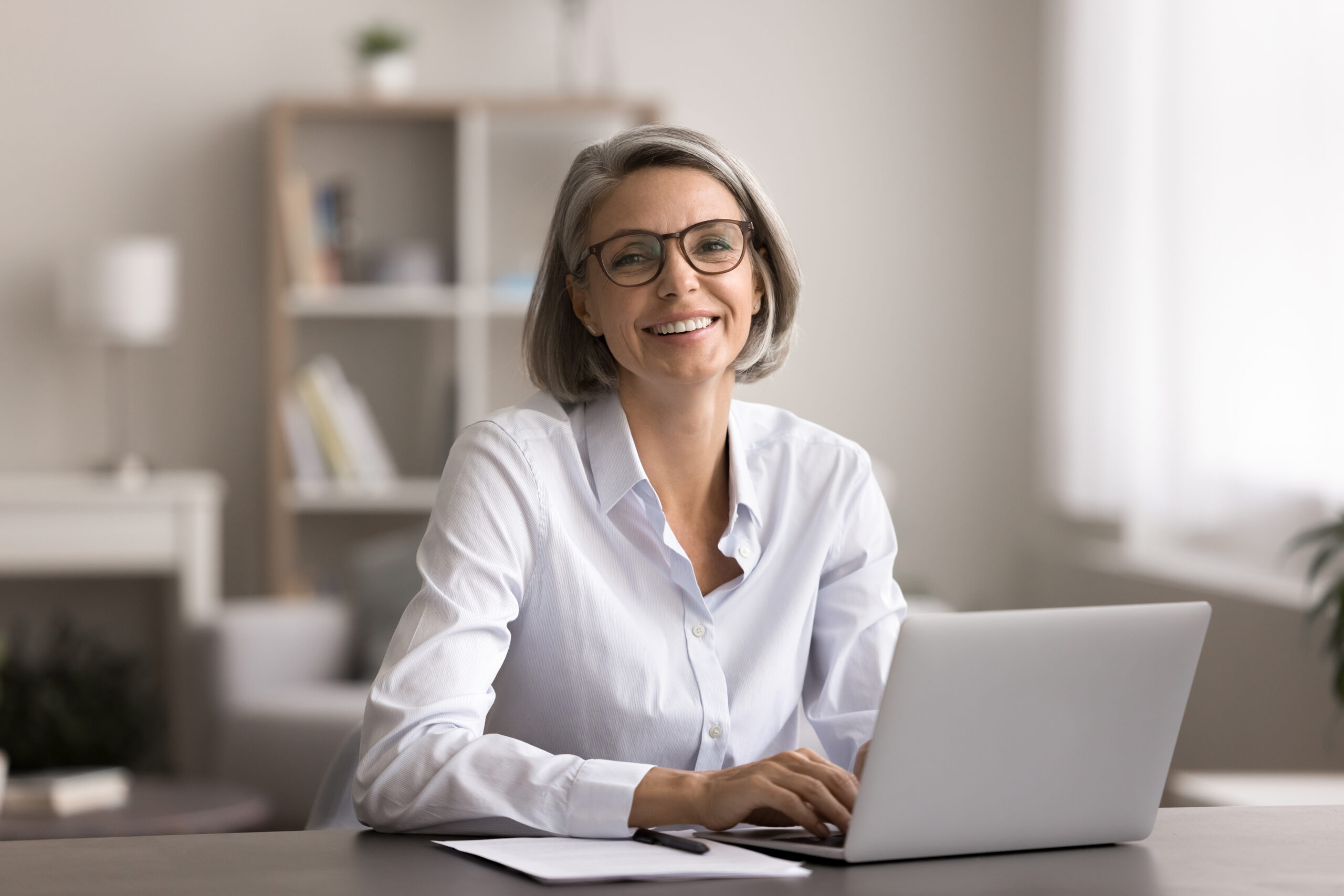 Happy,Middle-aged,Woman,With,Short,Gray,Hair,And,Glasses,,Smile,